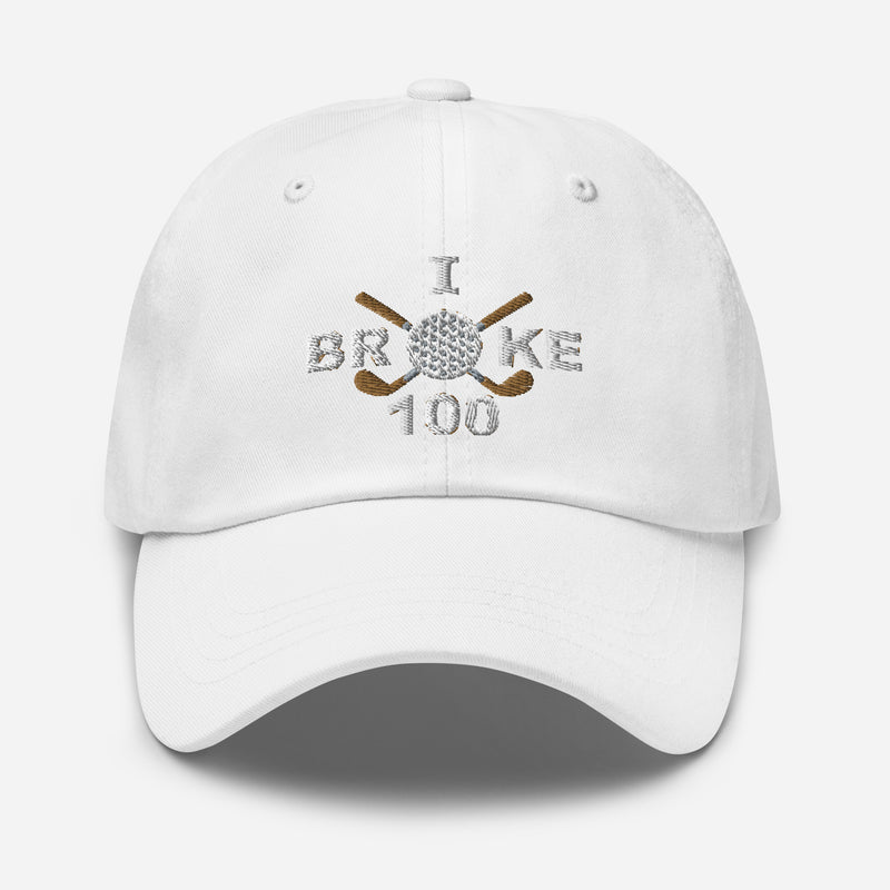 The "I Broke 100" Men's Embroidered Hat is a white, low-profile hat featuring the phrase "I Broke 70" on the front. The word "Broke" is uniquely stylized with a golf ball as the 'O' and crossed golf clubs beneath it.