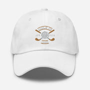 The Golf Hat in white - Hole in One with Personalized Month and Year features a golf design  including two crossed golf clubs with a golf ball at the center and the text "HOLE IN ONE" above. Customized month and year are on the left and right sides.
