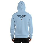 A person is standing with their back to the camera, wearing a Chess Championship light blue Hoodie. "South Jersey Champions 2024" is printed on the back. Below the text  is an image of a chess rook.