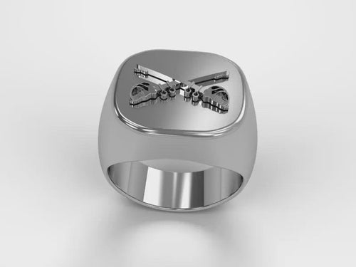 A video illustrating a sleek silver men's military style signet ring with a raised Cavalry Badge logo rotating on a 360 degree turn table.