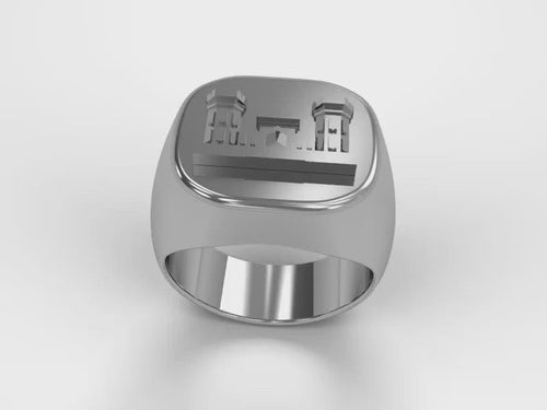 A video illustrating a sleek silver men's military style signet ring with a raised Combat Engineer Badge logo rotating on a 360 degree turn table.
