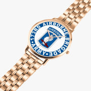 173rd Airborne Brigade Goldtone Watch is displayed in a perspective view on a white background with the gold metal strap stretched out.