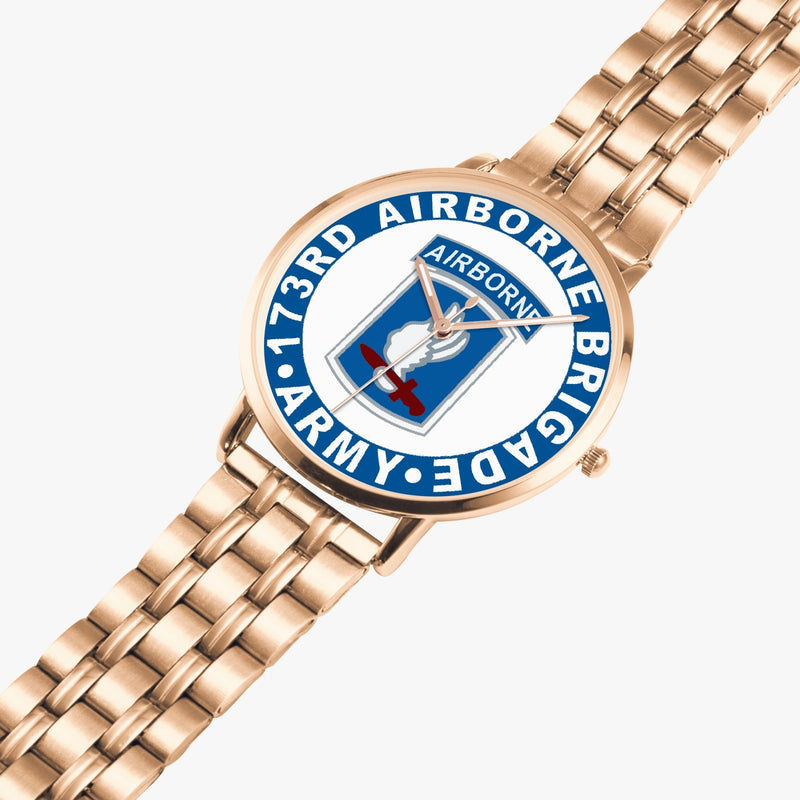 173rd Airborne Brigade Goldtone Watch is displayed in a perspective view on a white background with the gold metal strap stretched out.