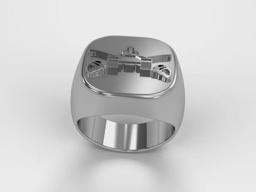 A video illustrating a sleek silver men's military style signet ring with a raised Armor Badge logo rotating on a 360 degree turn table.