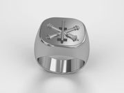 A video illustrating a sleek silver men's military style signet ring with a raised Air Defense Artillery Badge logo rotating on a 360 degree turn table.