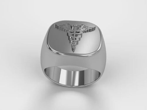 A video illustrating a sleek silver men's military style signet ring with a raised Hospital Corpsmen Badge logo rotating on a 360 degree turn table.