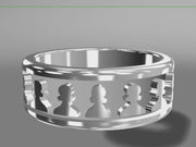 A video illustrating a sleek silver chess ring rotating on a 360 degree turn table.