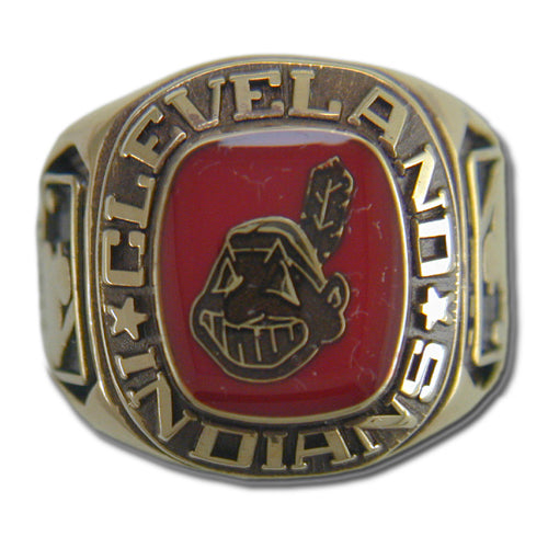 The Cleveland Indians Classic Goldplated MLB Ring features a distinctive design with a bold red face showcasing a cartoonish Native American head adorned with a feather. The words "CLEVELAND INDIANS" are elegantly engraved around the red face, making this goldtone ring stand out in celebration of Major League Baseball.