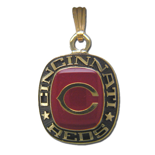 The Cincinnati Reds Goldtone Pendant with Enamel showcases a striking red enamel center accented by a bold, gold letter "C." The pendant reads "Cincinnati Reds" in gold lettering encircling the red enamel, flanked by a star on either side of the text.