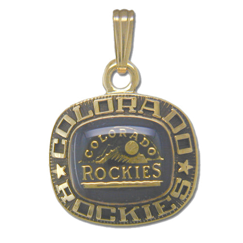 The Colorado Rockies Goldtone Pendant with Enamel by Balfour Sports features the team's logo prominently. The edge is inscribed with "Colorado Rockies" and stars, framing an inner design that showcases a mountain range, a baseball, and the word "Rockies" on a dark background. Celebrate your Major League Baseball loyalty in style with this elegant piece.