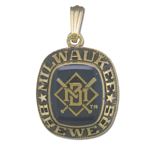 The Milwaukee Brewers Goldtone Pendant with Enamel features the "Milwaukee Brewers" text encircling a central emblem displaying crossed baseball bats and the letters "M" and "B." The emblem from Balfour Sports is set against a dark background, and the pendant includes a gold loop for attaching to a chain.