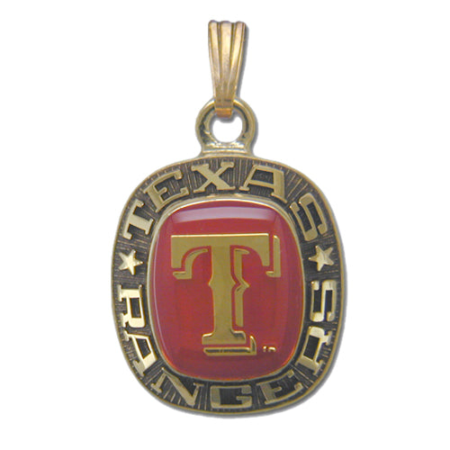 This Texas Rangers Goldtone Pendant with Enamel showcases the team's logo. The center features a large, gold "T" on a red background, while the surrounding border has "Texas Rangers" in capital letters, with a star on each side. A loop on top allows it to be worn on a chain.