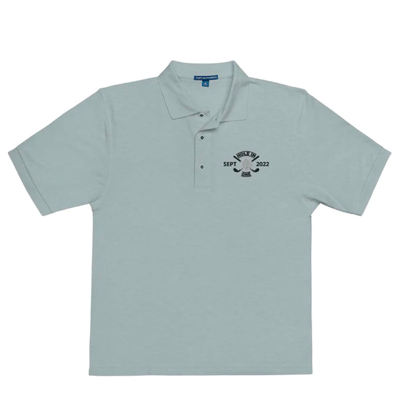 "Hole in One with Personalized Month and Year" - Cool Heather Golf shirt • 65% polyester, 35% cotton pique • Relaxed fit that runs large • Flat knit collar and cuffs