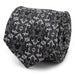 A rolled-up Mickey Mouse Damask Tile Men's Tie features a detailed black and gray damask pattern with ornate, symmetrical motifs. The fabric seamlessly integrates subtle Mickey Mouse silhouette accents, blending Disney charm with a sophisticated and classic appearance.