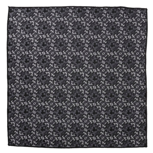 Introducing the Mickey Mouse Damask Tile Pocket Square: a black silk pocket square showcasing a consistent pattern of elegant, symmetrical designs in white. The motifs blend floral and geometric shapes, meticulously arranged in a grid-like layout, offering a sophisticated and visually intricate aesthetic.