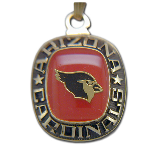 Show off your team spirit with the Arizona Cardinals Goldtone Pendant with Enamel, featuring the team logo on a red background and "ARIZONA CARDINALS" boldly inscribed—an eye-catching accessory for devoted fans.