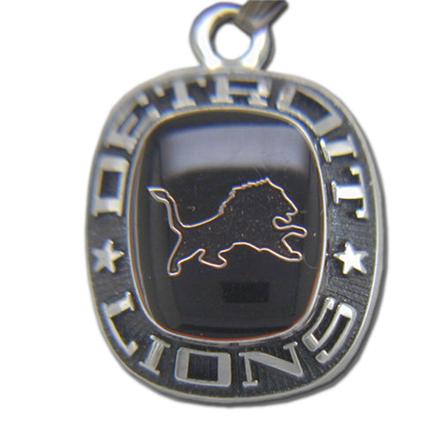 The Detroit Lions Celestrium Pendant with Enamel features the leaping lion logo and “DETROIT LIONS” with stars on a bold black background, making it an essential piece of NFL jewelry for any dedicated fan.