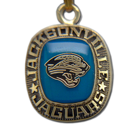 Show your team pride with the Jacksonville Jaguars Goldtone Pendant with Enamel. This pendant features a blue enamel center, team logo, and “JACKSONVILLE JAGUARS” with stars encircling the design for a standout look.