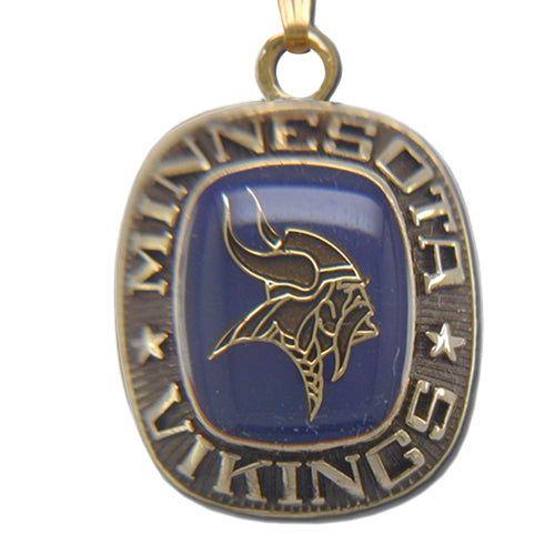 A Minnesota Vikings Goldtone Pendant with Enamel, featuring the team's Viking head logo on blue, "Minnesota Vikings" inscribed around the edge, and a star on each side.
