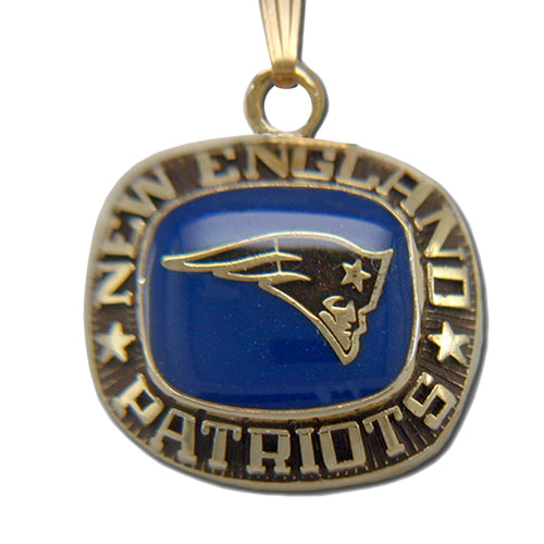 Show your Patriots pride with the New England Patriots Goldtone Pendant with Enamel, featuring the team's logo on a blue background, "NEW ENGLAND PATRIOTS" engraved around the edge, and stars on either side.