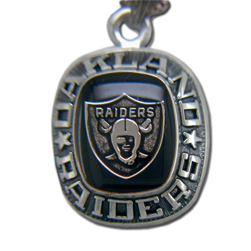 Show your team pride with the Oakland Raiders Celestrium Pendant with Enamel, featuring the iconic shield logo and "RAIDERS" design—an ideal accessory for any passionate NFL fan.