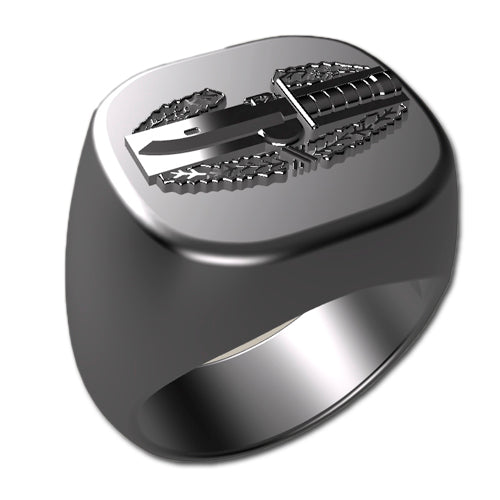 A sleek silver men's military style signet ring with a raised Combat Action Badge logo on top and boasting a modern, polished finish.