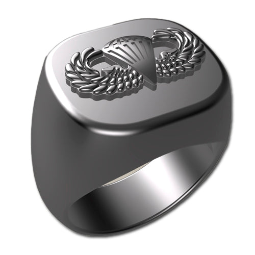 A sleek silver men's military style signet ring with a raised Basic Parachutist Badge logo on top and boasting a modern, polished finish.