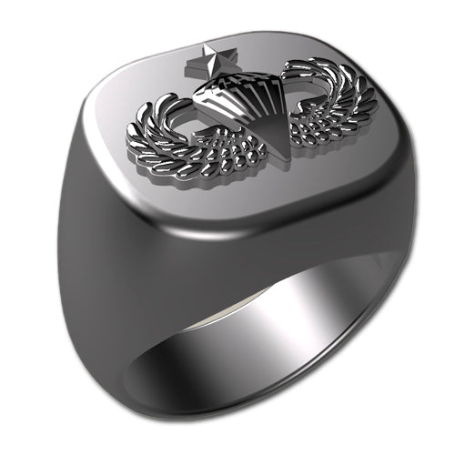 A sleek silver men's military style signet ring with a raised Senior Parachutist Badge logo on top and boasting a modern, polished finish.