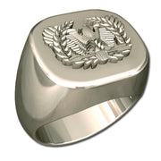 A sleek silver men's military style signet ring with a raised Warrant Officer Badge logo on top and boasting a modern, polished finish