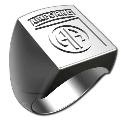 A sleek silver men's military style square ring with a raised 82nd Airborne Division Badge logo on top and boasting a modern, polished finish.