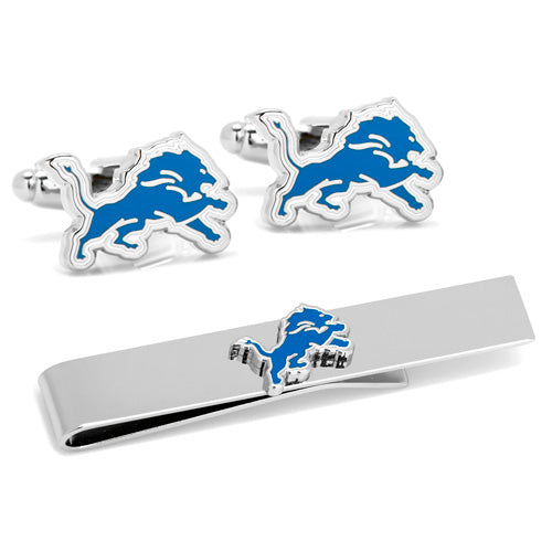 The Detroit Lions Cufflinks and Tie Bar Gift Set includes officially licensed cufflinks and a tie bar featuring the iconic blue roaring lion logo. With elegant silver borders, these accessories are beautifully arranged on a white background, making them an ideal addition to any NFL-themed gift package.