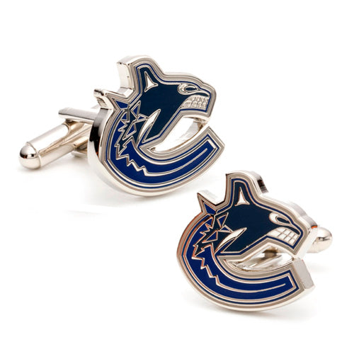 The Vancouver Canucks Cufflinks feature a stylized blue and white whale breaking through ice logo, representing the NHL team. These silver accessories are bold and eye-catching, perfect for fans of the sport.
