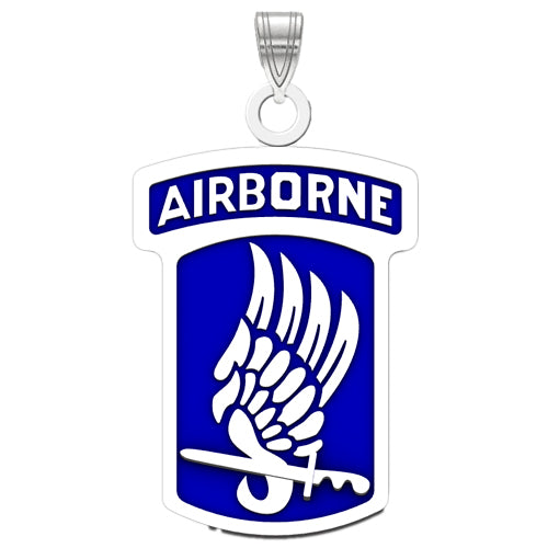 The 173rd Airborne Brigade Sterling Silver Pendant with enamel is a striking piece of US Army Airborne jewelry. It features a blue background, adorned with a white winged sword emblem and labeled "Airborne" at the top. 