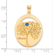 Family Tree Oval Gold Pendant With 1 Birthstone. The pendant is shown on a ruled background.