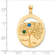Family Tree Oval Gold Pendant With 2 Birthstones. The pendant is shown on a ruled background.