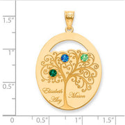Family Tree Oval Gold Pendant With 3 Birthstones. The pendant is shown on a ruled background. The pendant is shown on a ruled background.