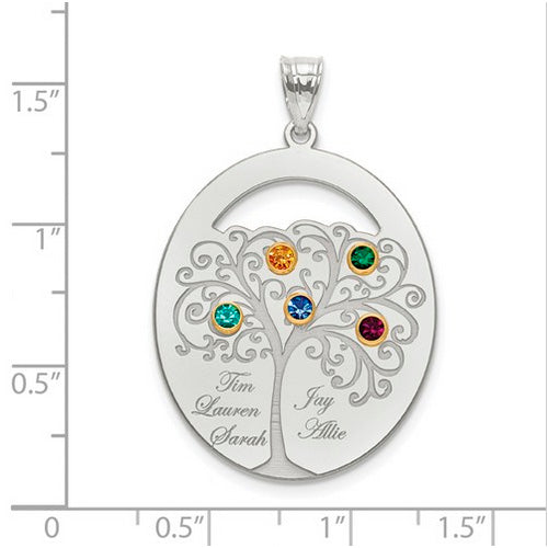 An Oval Silver Pendant With 5 Birthstones, featuring a detailed tree design with four colorful gems. Each branch holds a birthstone and a name. The pendant is shown on a ruled background.