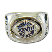 The Dallas Cowboys Super Bowl XXVIII Silvertone Ring showcases a football design with "SUPER BOWL XXVIII" engraved at the center, making it a perfect collectible for fans.