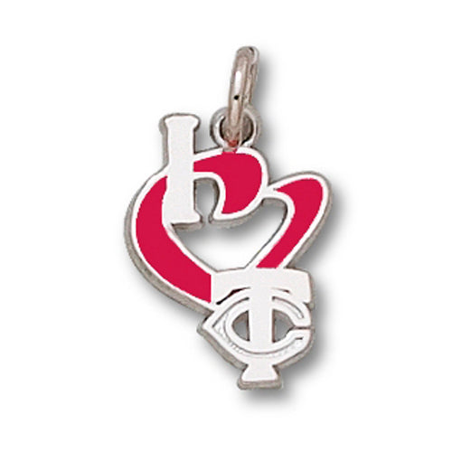 Introducing the Minnesota Twins I Heart Logo WITH ENAMEL Pendant, a sterling silver accessory featuring a distinctive design that combines the letters "H," "C," and "T." The pendant showcases an "H" placed above a red heart shape, reminiscent of an I Heart Logo Pendant, with the "T" and "C" elegantly intertwined below. A small loop at the top allows for easy attachment to a chain.