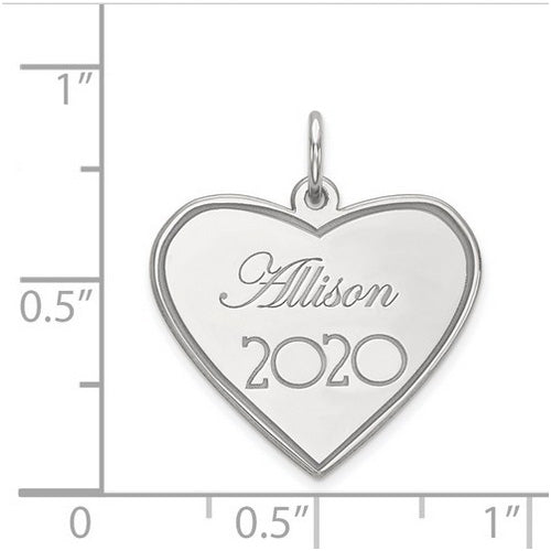 Heart Personalized Name/Year Silver Pendant. The pendant is shown on a ruled background.