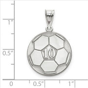 The Sterling Silver Rhodium-plated Laser Soccer Number And Name Pendant, in the shape of a soccer ball with the number 10 engraved on it, is displayed on graph paper that indicates the pendant is approximately 1 inch in diameter.