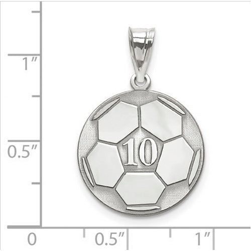 The Sterling Silver Rhodium-plated Laser Soccer Number And Name Pendant, in the shape of a soccer ball with the number 10 engraved on it, is displayed on graph paper that indicates the pendant is approximately 1 inch in diameter.