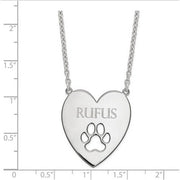 Sterling Silver Rhodium-plated Heart with Dog Paw Print Necklace. The pendant is shown on a ruled background.