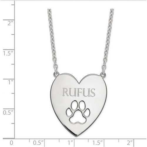 Sterling Silver Rhodium-plated Heart with Dog Paw Print Necklace. The pendant is shown on a ruled background.