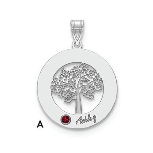 The Circle Pendant With 1 Birthstone showcases a round silver pendant featuring a detailed tree cutout. A small red birthstone is set at the bottom left of the tree, with the name "Ashley" inscribed nearby. This high-quality gold pendant hangs from a decorated bail, which has the letter "A" on its left side.