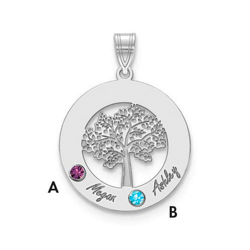 The Circle Pendant With 2 Birthstones is a quality silver accessory featuring a detailed tree in the center. It includes two colored gems: one purple (A) and one blue (B). "Megan" is engraved next to gem A, while "Ashley" is engraved next to gem B. This birthstone pendant has a loop at the top for attaching to a necklace chain.