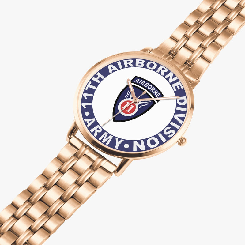 11th Airborne Division Goldtone Watch is displayed in a perspective view on a white background with the gold metal strap stretched out.
