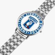 173rd Airborne Brigade Silvertone Watch is displayed in a perspective view on a white background with the silver metal strap stretched out.