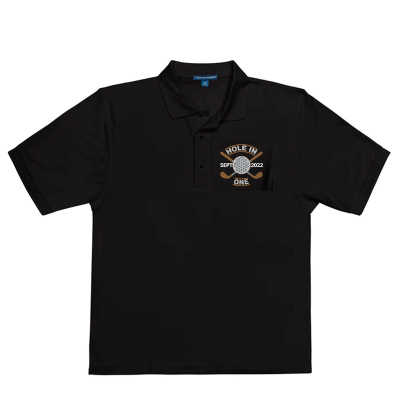 "Hole in One with Personalized Month and Year" - Black Golf shirt • 65% polyester, 35% cotton pique • Relaxed fit that runs large • Flat knit collar and cuffs