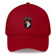 A cranberry colored 101st Airborne Hat with the logo on the front.  The hat has a curved visor and an adjustable strap at the back.